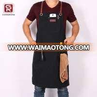 Durable black canvas carpenter apron with cross back leather straps